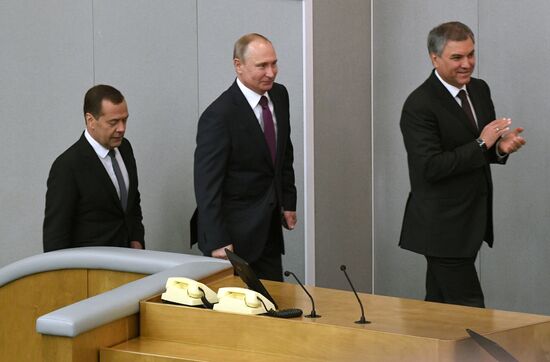 Russian President Vladimir Putin and candidate for Prime Minister Dmitry Medvedev attend State Duma plenary meeting