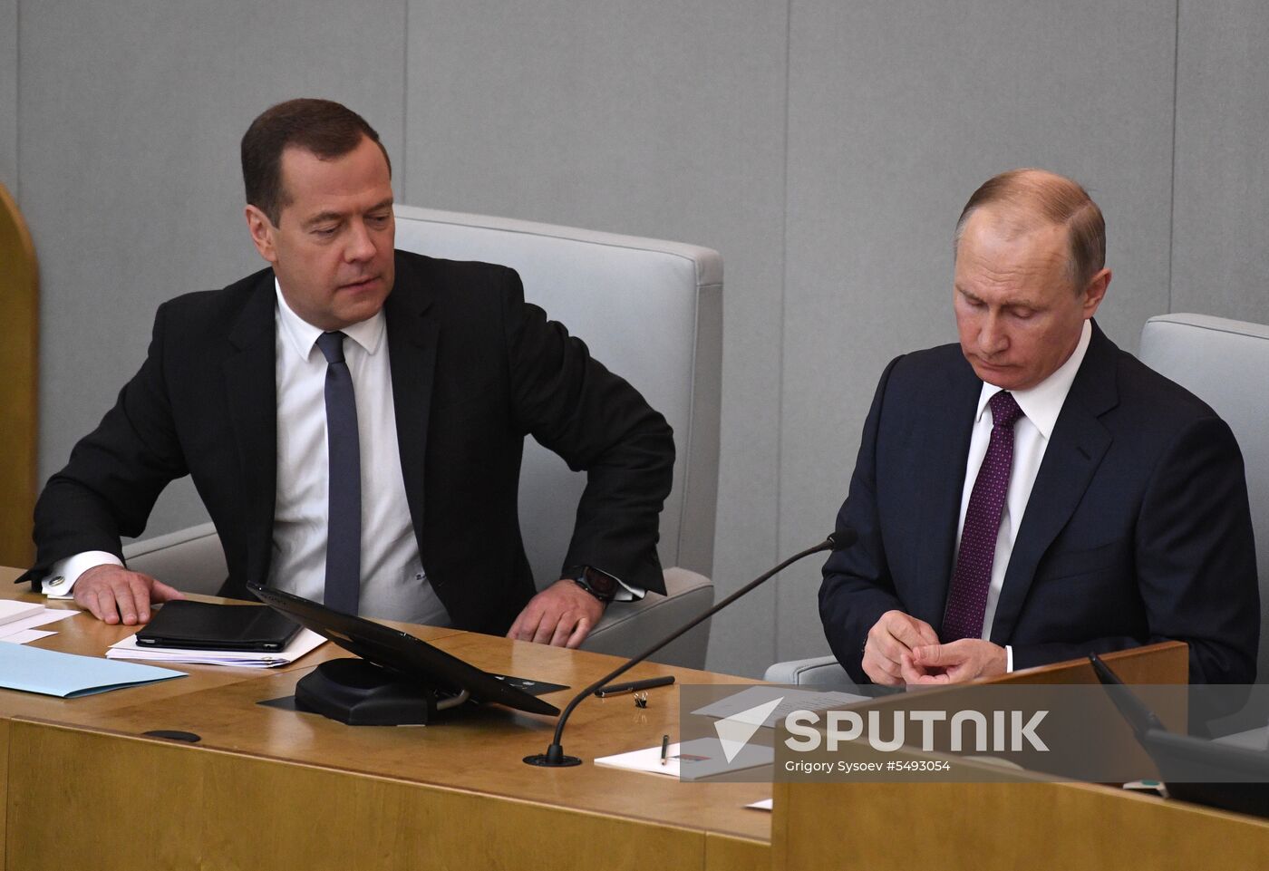 Russian President Vladimir Putin and candidate for Prime Minister Dmitry Medvedev attend State Duma plenary meeting