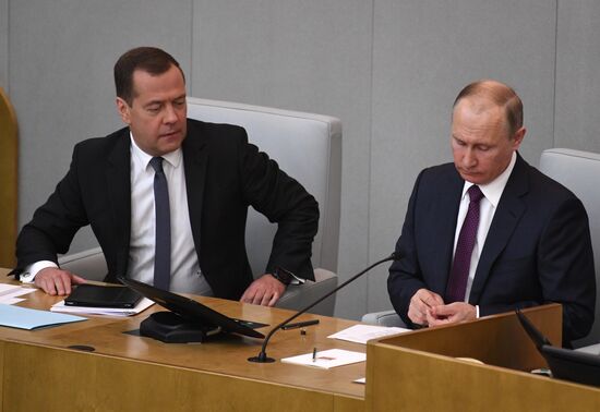 Russian President Vladimir Putin and candidate for Prime Minister Dmitry Medvedev attend State Duma plenary meeting
