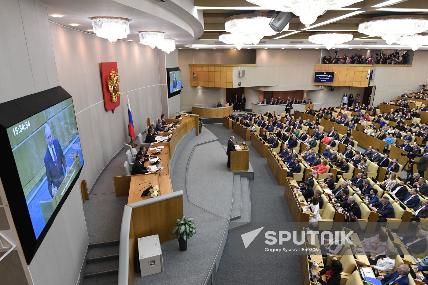 Russian President Vladimir Putin and candidate for Prime Minister Dmitry Medvedev attend State Duma plenary meeting