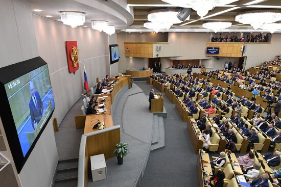 Russian President Vladimir Putin and candidate for Prime Minister Dmitry Medvedev attend State Duma plenary meeting