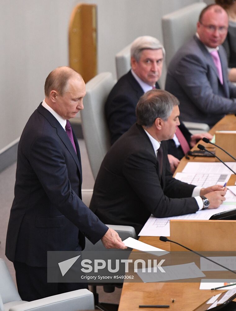 Russian President Vladimir Putin and candidate for Prime Minister Dmitry Medvedev attend State Duma plenary meeting