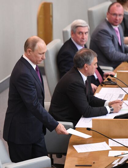 Russian President Vladimir Putin and candidate for Prime Minister Dmitry Medvedev attend State Duma plenary meeting