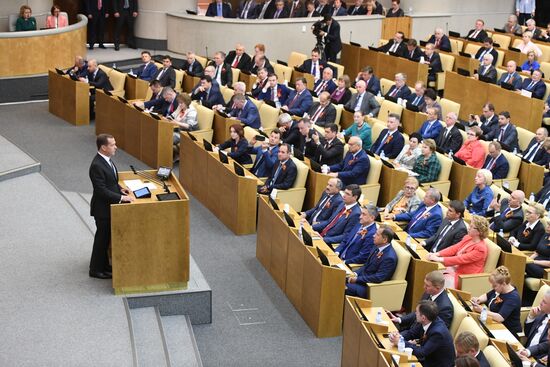 Russian President Vladimir Putin and candidate for Prime Minister Dmitry Medvedev attend State Duma plenary meeting