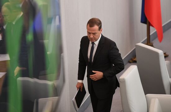 Russian President Vladimir Putin and candidate for Prime Minister Dmitry Medvedev attend State Duma plenary meeting