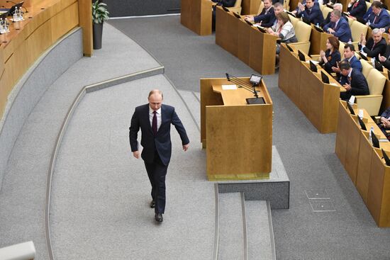 Russian President Vladimir Putin and candidate for Prime Minister Dmitry Medvedev attend State Duma plenary meeting