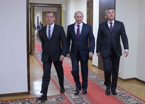 Russian President Vladimir Putin and candidate for Prime Minister Dmitry Medvedev attend State Duma plenary meeting