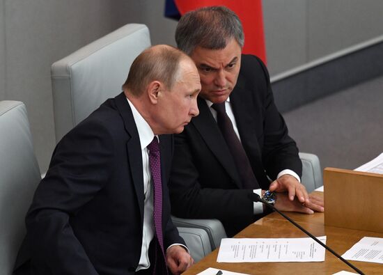 Russian President Vladimir Putin and candidate for Prime Minister Dmitry Medvedev attend State Duma plenary meeting