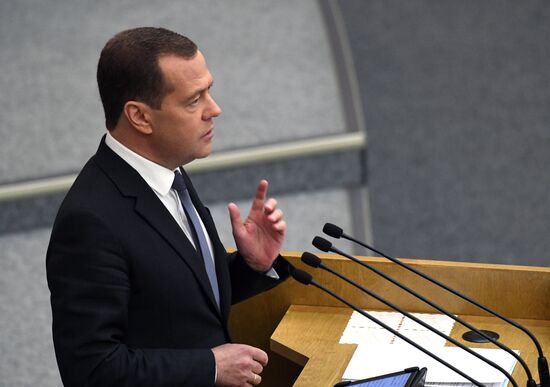 Russian President Vladimir Putin and candidate for Prime Minister Dmitry Medvedev attend State Duma plenary meeting