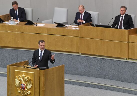 Russian President Vladimir Putin and candidate for Prime Minister Dmitry Medvedev attend State Duma plenary meeting