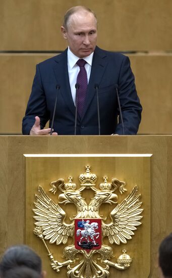 Russian President Vladimir Putin and candidate for Prime Minister Dmitry Medvedev attend State Duma plenary meeting
