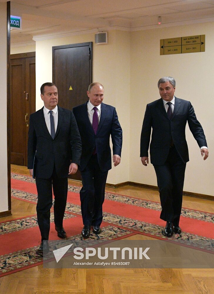 Russian President Vladimir Putin and candidate for Prime Minister Dmitry Medvedev attend State Duma plenary meeting