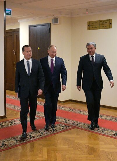 Russian President Vladimir Putin and candidate for Prime Minister Dmitry Medvedev attend State Duma plenary meeting