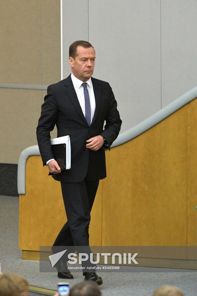 Russian President Vladimir Putin and candidate for Prime Minister Dmitry Medvedev attend State Duma plenary meeting
