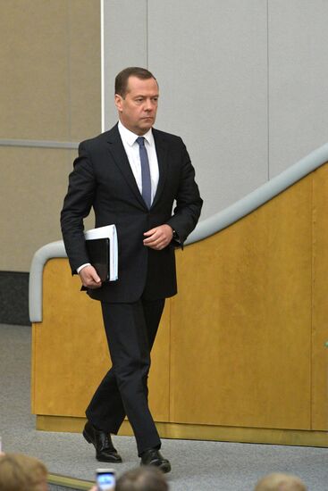 Russian President Vladimir Putin and candidate for Prime Minister Dmitry Medvedev attend State Duma plenary meeting