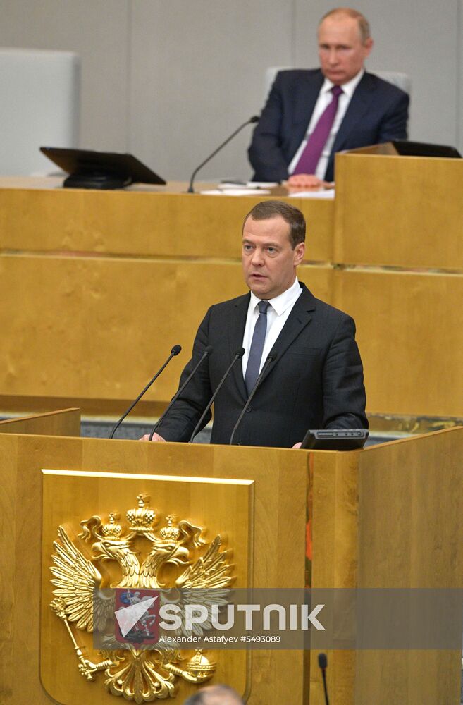 Russian President Vladimir Putin and candidate for Prime Minister Dmitry Medvedev attend State Duma plenary meeting