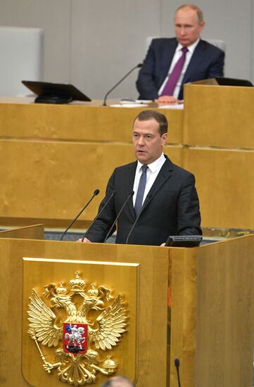 Russian President Vladimir Putin and candidate for Prime Minister Dmitry Medvedev attend State Duma plenary meeting