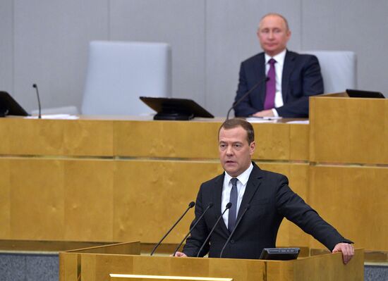Russian President Vladimir Putin and candidate for Prime Minister Dmitry Medvedev attend State Duma plenary meeting