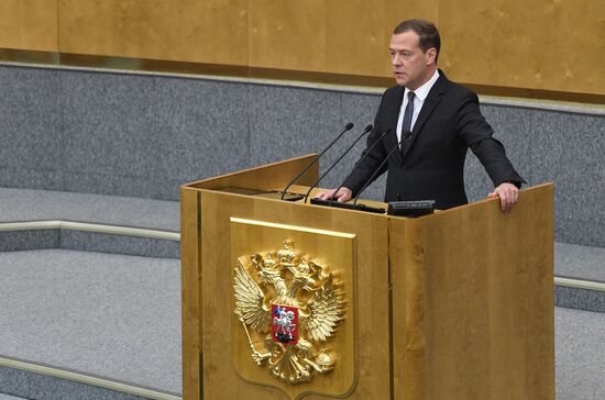 Russian President Vladimir Putin and candidate for Prime Minister Dmitry Medvedev attend State Duma plenary meeting
