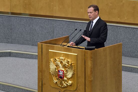 Russian President Vladimir Putin and candidate for Prime Minister Dmitry Medvedev attend State Duma plenary meeting