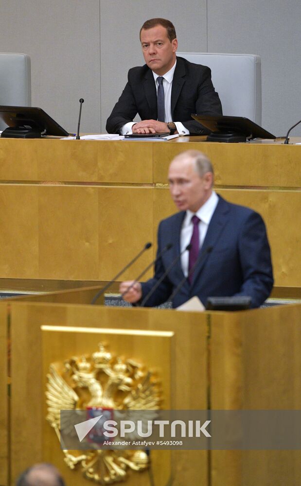 Russian President Vladimir Putin and candidate for Prime Minister Dmitry Medvedev attend State Duma plenary meeting