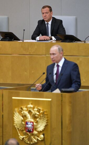 Russian President Vladimir Putin and candidate for Prime Minister Dmitry Medvedev attend State Duma plenary meeting