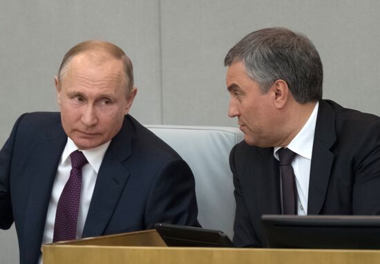 Russian President Vladimir Putin and candidate for Prime Minister Dmitry Medvedev attend State Duma plenary meeting