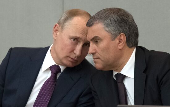 Russian President Vladimir Putin and candidate for Prime Minister Dmitry Medvedev attend State Duma plenary meeting