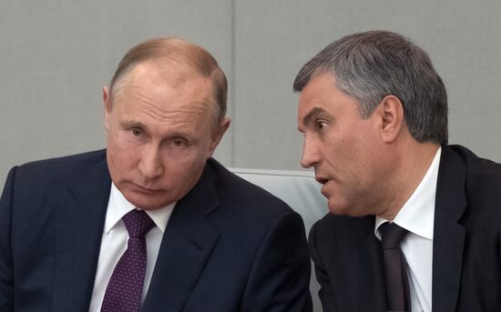 Russian President Vladimir Putin and candidate for Prime Minister Dmitry Medvedev attend State Duma plenary meeting