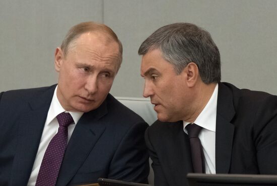 Russian President Vladimir Putin and candidate for Prime Minister Dmitry Medvedev attend State Duma plenary meeting