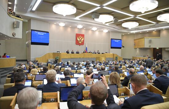 Russian President Vladimir Putin and candidate for Prime Minister Dmitry Medvedev attend State Duma plenary meeting