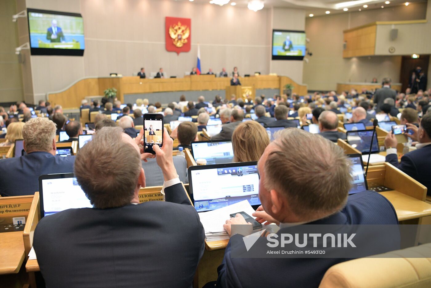 Russian President Vladimir Putin and candidate for Prime Minister Dmitry Medvedev attend State Duma plenary meeting