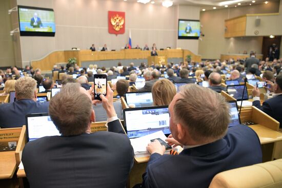 Russian President Vladimir Putin and candidate for Prime Minister Dmitry Medvedev attend State Duma plenary meeting