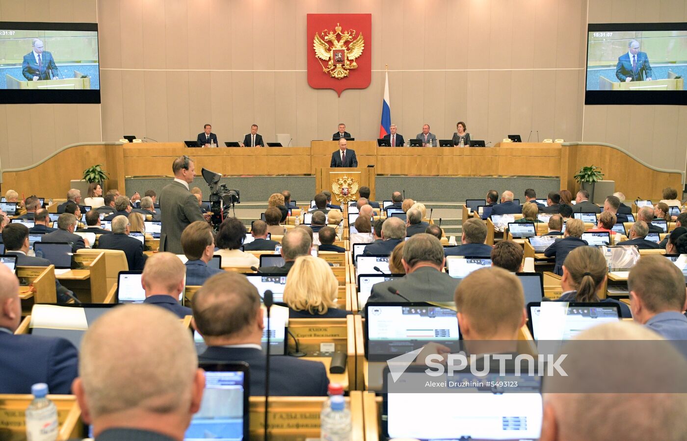Russian President Vladimir Putin and candidate for Prime Minister Dmitry Medvedev attend State Duma plenary meeting
