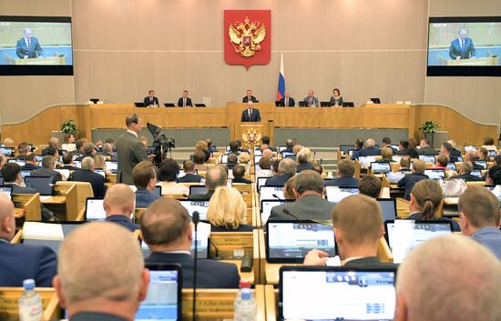 Russian President Vladimir Putin and candidate for Prime Minister Dmitry Medvedev attend State Duma plenary meeting