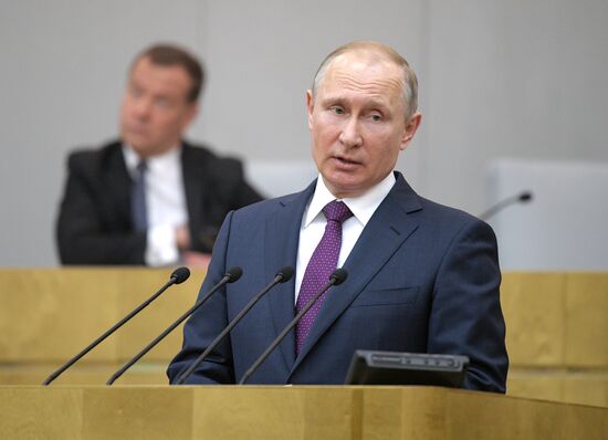 Russian President Vladimir Putin and candidate for Prime Minister Dmitry Medvedev attend State Duma plenary meeting