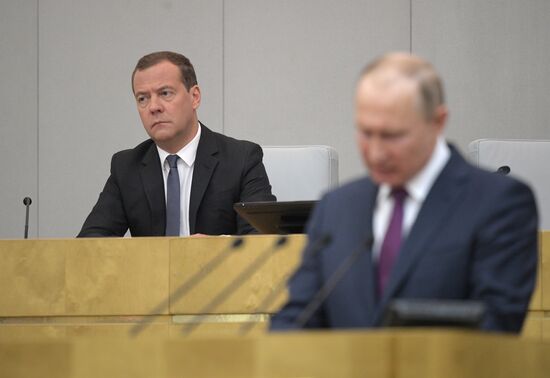 Russian President Vladimir Putin and candidate for Prime Minister Dmitry Medvedev attend State Duma plenary meeting