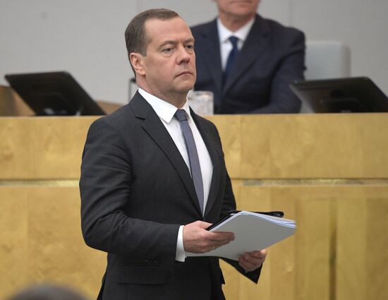 Russian President Vladimir Putin and candidate for Prime Minister Dmitry Medvedev attend State Duma plenary meeting
