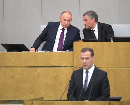 Russian President Vladimir Putin and candidate for Prime Minister Dmitry Medvedev attend State Duma plenary meeting