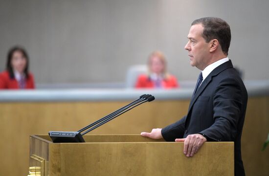 Russian President Vladimir Putin and candidate for Prime Minister Dmitry Medvedev attend State Duma plenary meeting