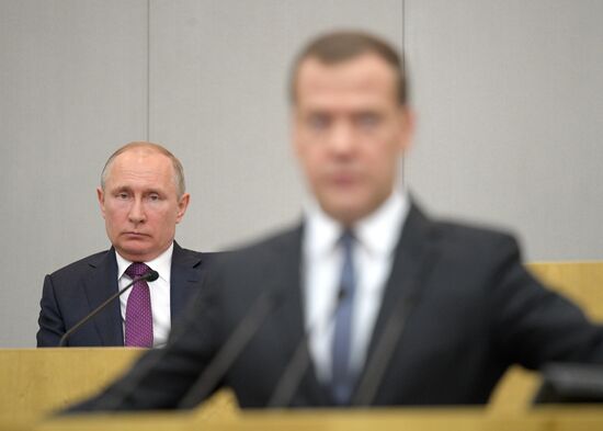 Russian President Vladimir Putin and candidate for Prime Minister Dmitry Medvedev attend State Duma plenary meeting