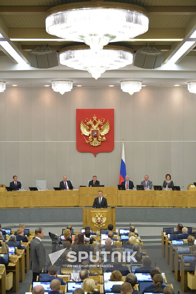 Russian President Vladimir Putin and candidate for Prime Minister Dmitry Medvedev attend State Duma plenary meeting