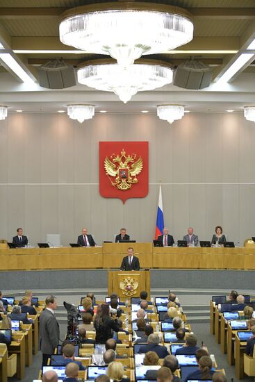 Russian President Vladimir Putin and candidate for Prime Minister Dmitry Medvedev attend State Duma plenary meeting