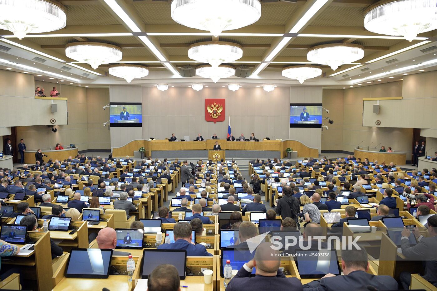 Russian President Vladimir Putin and candidate for Prime Minister Dmitry Medvedev attend State Duma plenary meeting