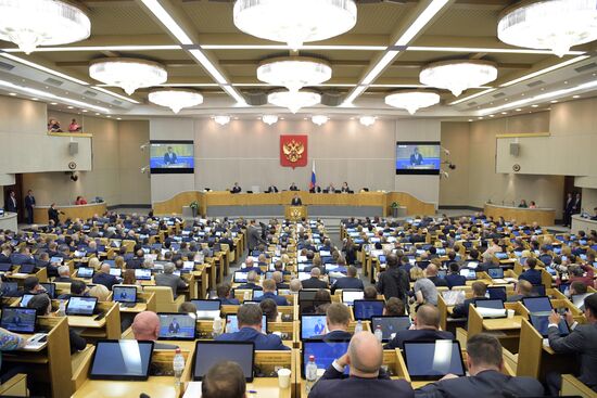Russian President Vladimir Putin and candidate for Prime Minister Dmitry Medvedev attend State Duma plenary meeting