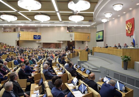 Russian President Vladimir Putin and candidate for Prime Minister Dmitry Medvedev attend State Duma plenary meeting
