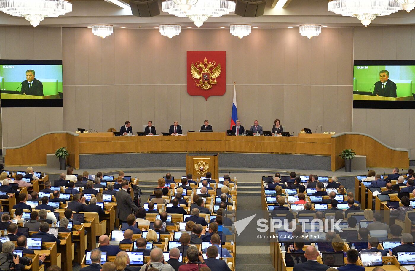 Russian President Vladimir Putin and candidate for Prime Minister Dmitry Medvedev attend State Duma plenary meeting