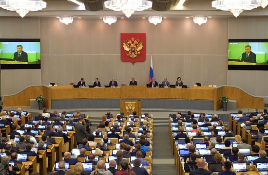 Russian President Vladimir Putin and candidate for Prime Minister Dmitry Medvedev attend State Duma plenary meeting