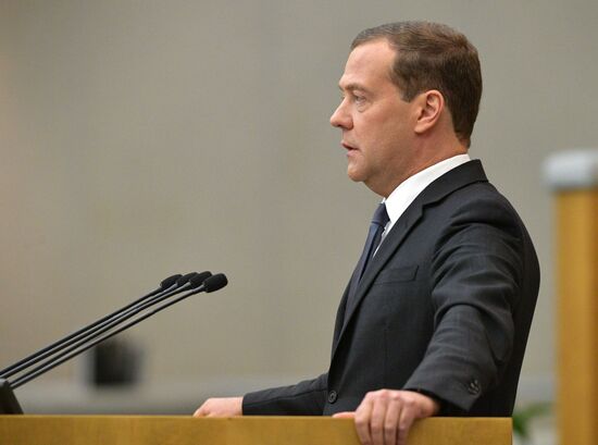 Russian President Vladimir Putin and candidate for Prime Minister Dmitry Medvedev attend State Duma plenary meeting
