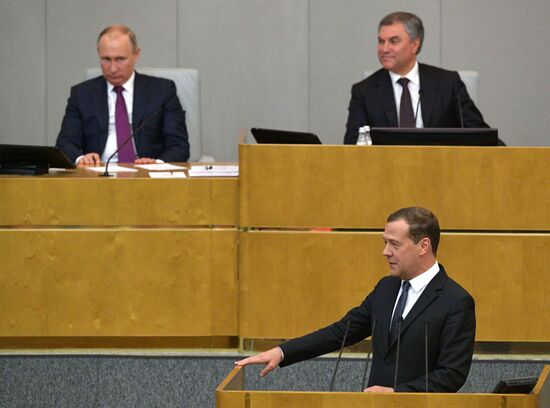 Russian President Vladimir Putin and candidate for Prime Minister Dmitry Medvedev attend State Duma plenary meeting